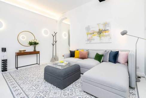 Bright and stylish living room in Sliema Norfolk Street Apartments with contemporary decor and color.