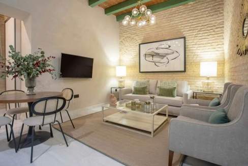 Modern living room with stylish furniture and decorative artwork in Seville.