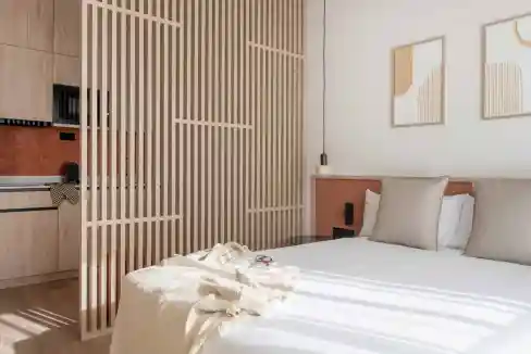 Modern minimalist bedroom with natural wood accents, soft neutral tones, and stylish decor for a coz.