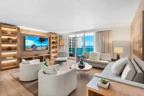 Ocean-view living room with beach decor, bright natural light, and contemporary furniture.