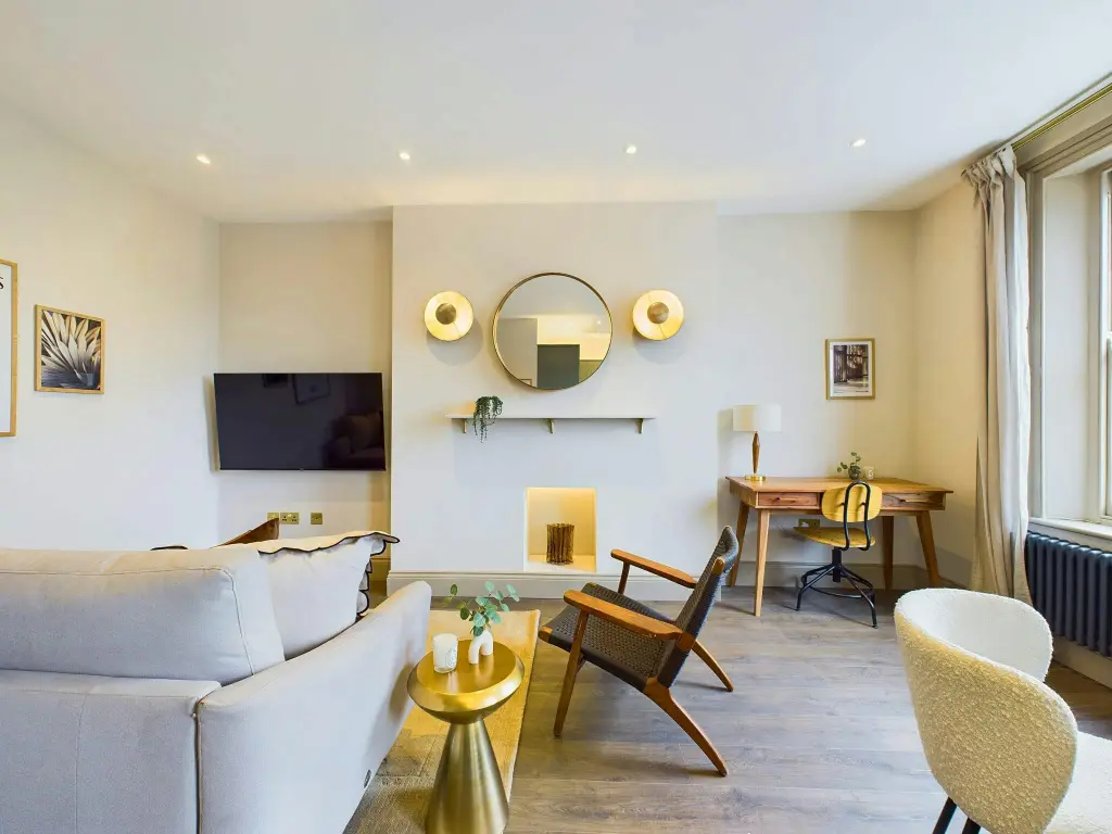 Contemporary living room with minimalist design, neutral tones, and stylish furniture.