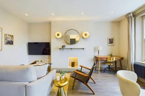 Contemporary living room with minimalist design, neutral tones, and stylish furniture.