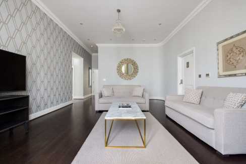 Elegant living room with contemporary furniture and stylish decor elements.