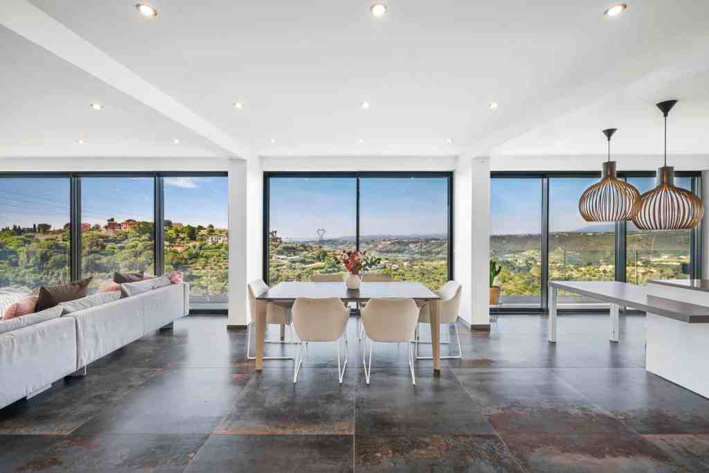 Bright living room with panoramic city views and modern decor.