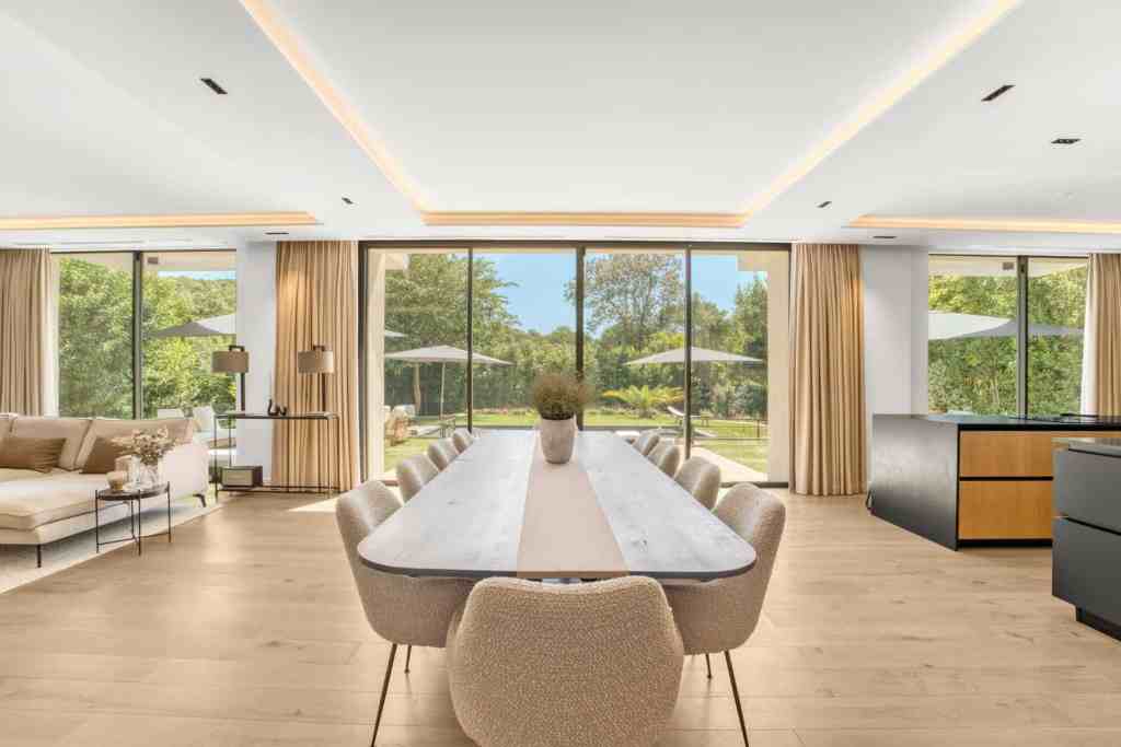 Spacious dining area with large windows and natural light.