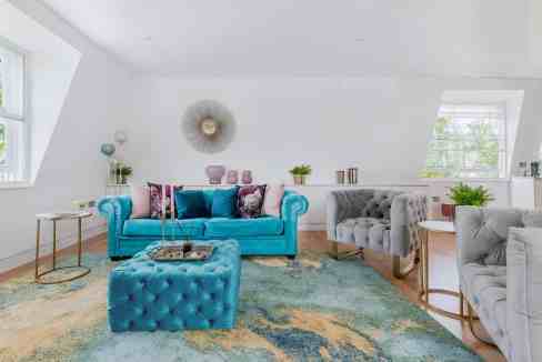 Bright and stylish living room with colorful furniture and decor.