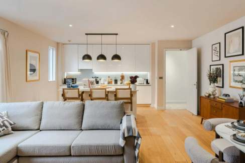 Contemporary living space with open-plan kitchen and dining area.