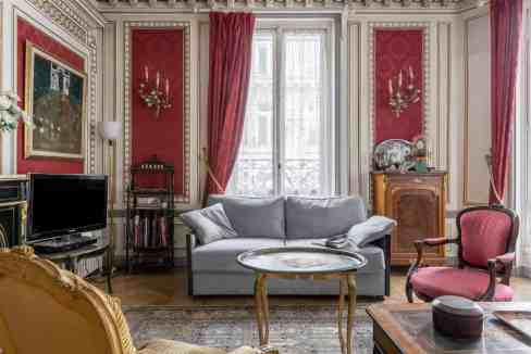 Luxurious classic living room with ornate details and elegant furnishings.