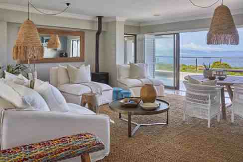 Bright coastal living room with ocean view and natural decor.