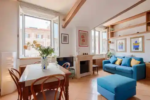 Bright living room with large windows and stylish decor.