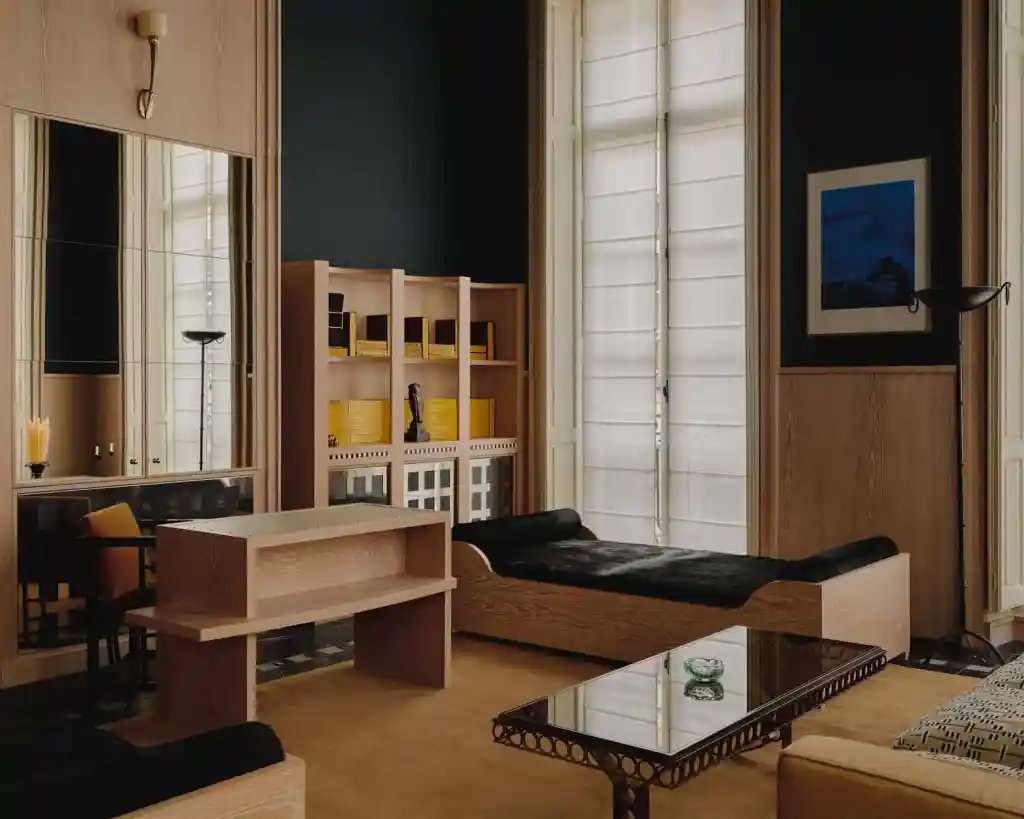 Modern serviced apartment interior with minimalist furniture and large windows.