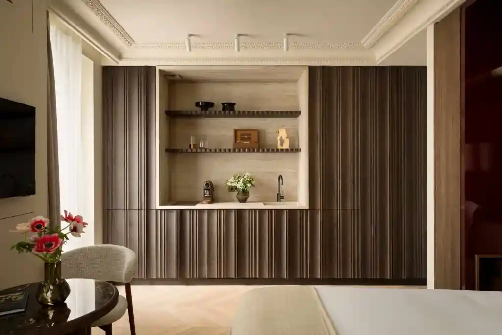 Elegant living room with built-in wooden shelves and decor.
