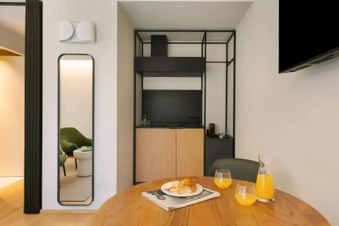 Contemporary kitchen with compact design in a serviced apartment.