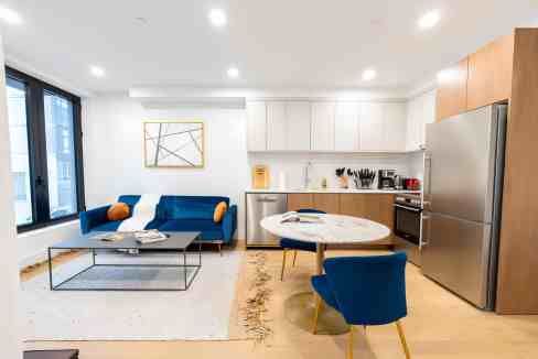 Bright, modern Greenpoint apartment living room and kitchen.