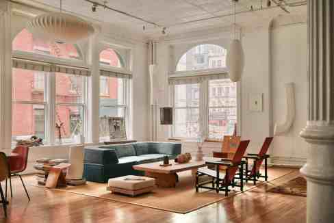Spacious loft with large windows, modern furniture, and natural light in Tribeca Lightworks Loft.