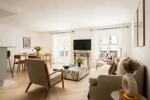 Bright and spacious living room with modern furniture and large windows.