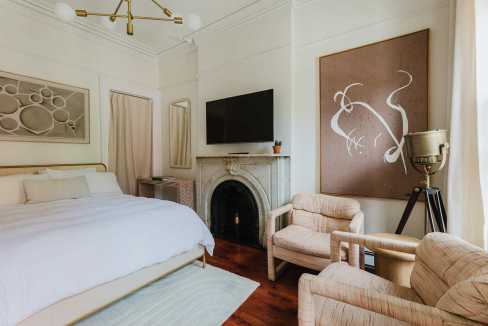 Stylish bedroom in Greenwich Village with modern decor and cozy seating area.