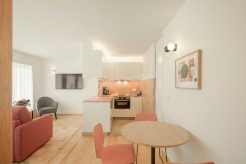 Modern serviced apartment interior with dining and living area in Lisbon.