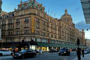 Harrods department store in Knightsbridge, London at dusk.