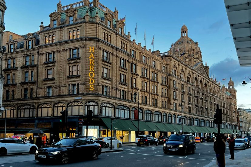 Harrods department store in Knightsbridge, London at dusk.