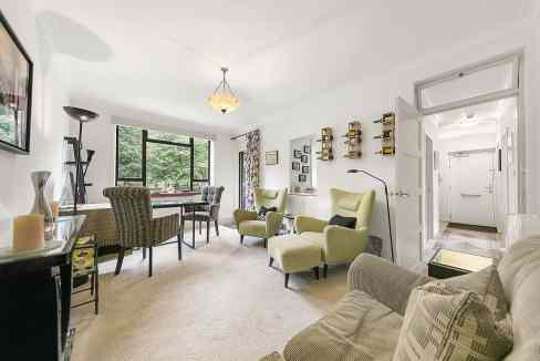 Spacious living room with modern furniture and large window in Clerkenwell Garden Poise.