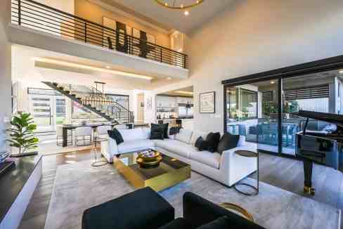 Spacious living room with modern furniture and panoramic windows.