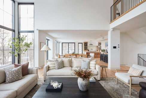 Bright and airy living room with large windows and contemporary furniture.