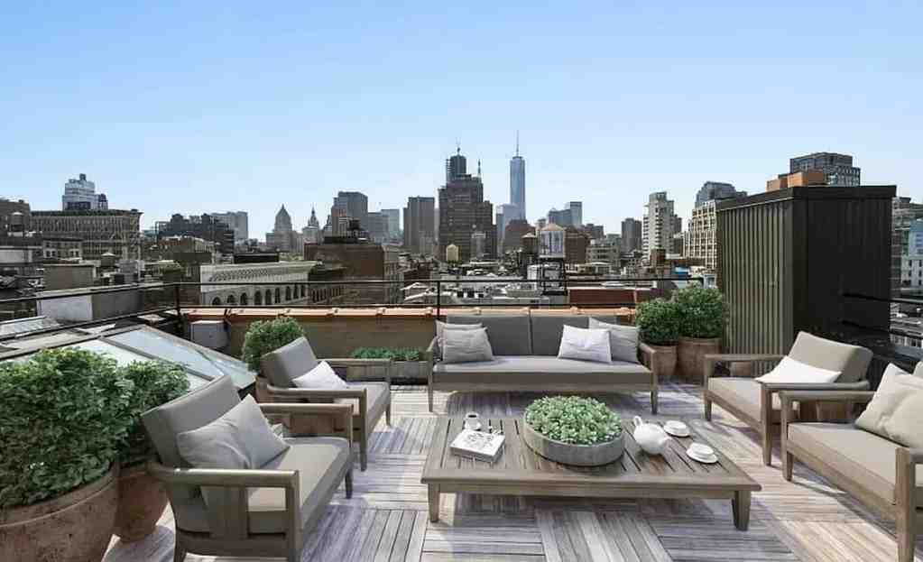 Rooftop lounge with city skyline view at Spring Street Penthouse.