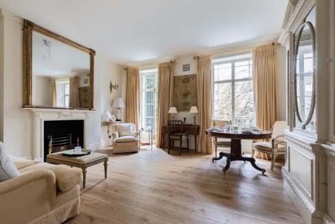 Spacious and bright living room with classic decor and large windows in Knightsbridge Brompton.