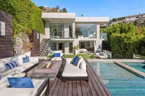Contemporary villa with outdoor pool and stylish seating area.