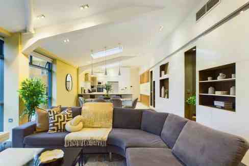 Spacious living room with contemporary furniture and natural light.