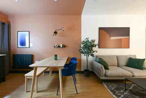 Contemporary living and dining space with stylish decor and cozy seating.