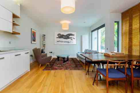 Bright and spacious living room in a serviced apartment with contemporary decor.