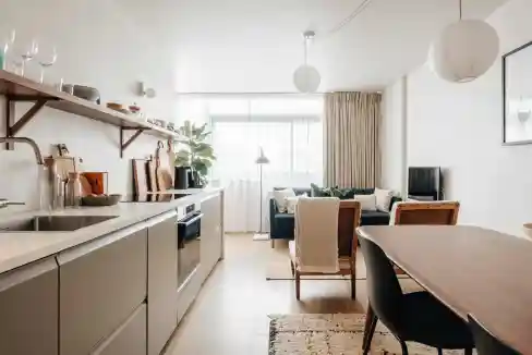 Bright and airy living room in a serviced apartment with minimalist decor.