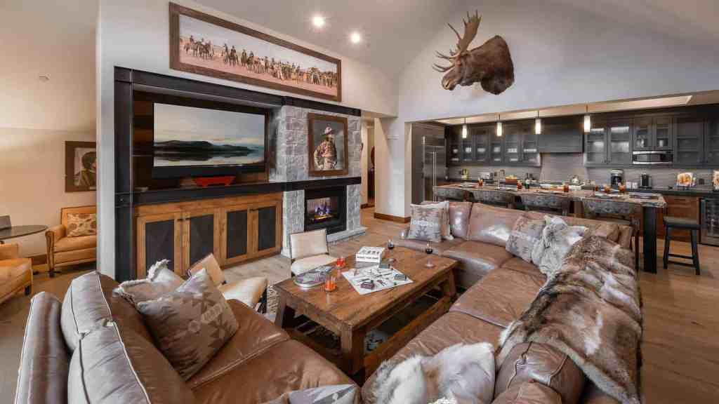 Spacious living room with mountain decor and cozy seating.