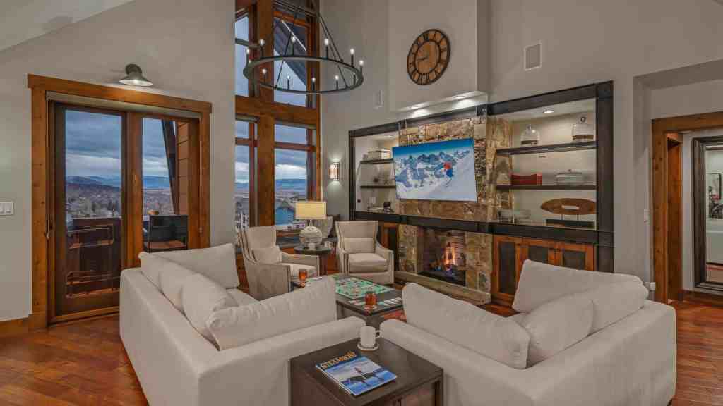 Spacious living room with modern decor and mountain views at Diamond Peak Luxe.