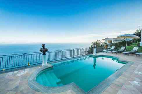 Infinity pool overlooking the Amalfi Coast with scenic ocean views.