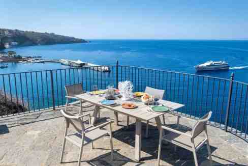 Outdoor dining with ocean view at Clifftop Sorrento Villa.