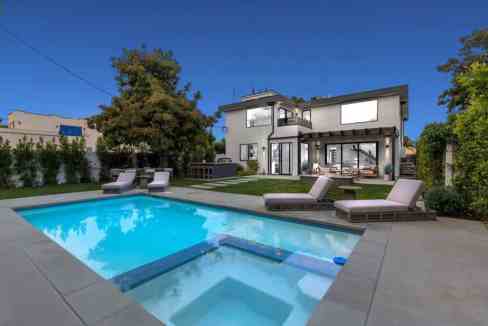 Contemporary Beverly Grove house with swimming pool and outdoor lounge.