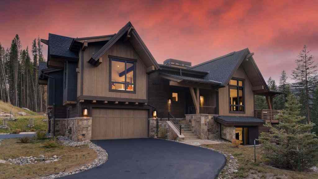 Elegant mountain chalet with large windows and scenic surroundings in Breckenridge.