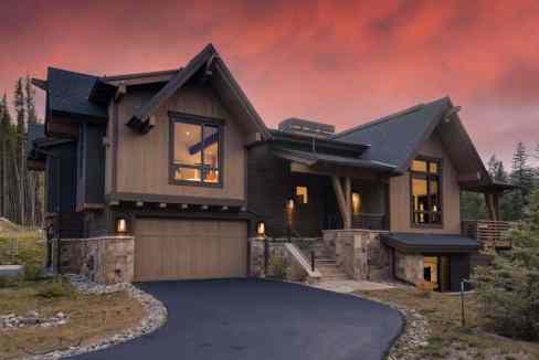 Elegant mountain chalet with large windows and scenic surroundings in Breckenridge.