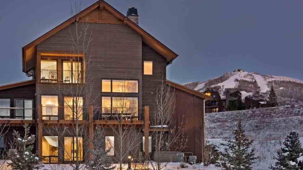 Contemporary mountain chalet with large windows and wooden exterior in Steamboat.