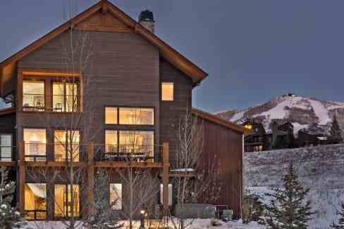 Contemporary mountain chalet with large windows and wooden exterior in Steamboat.