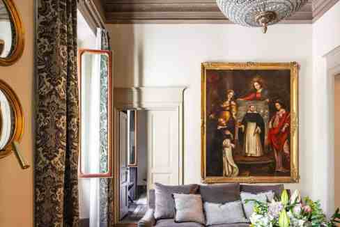 Luxurious living room with classic decor and chandelier in Florence style.