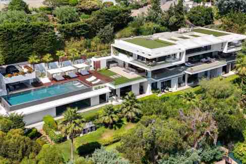 Modern serviced apartments with rooftop pool and lush garden views.