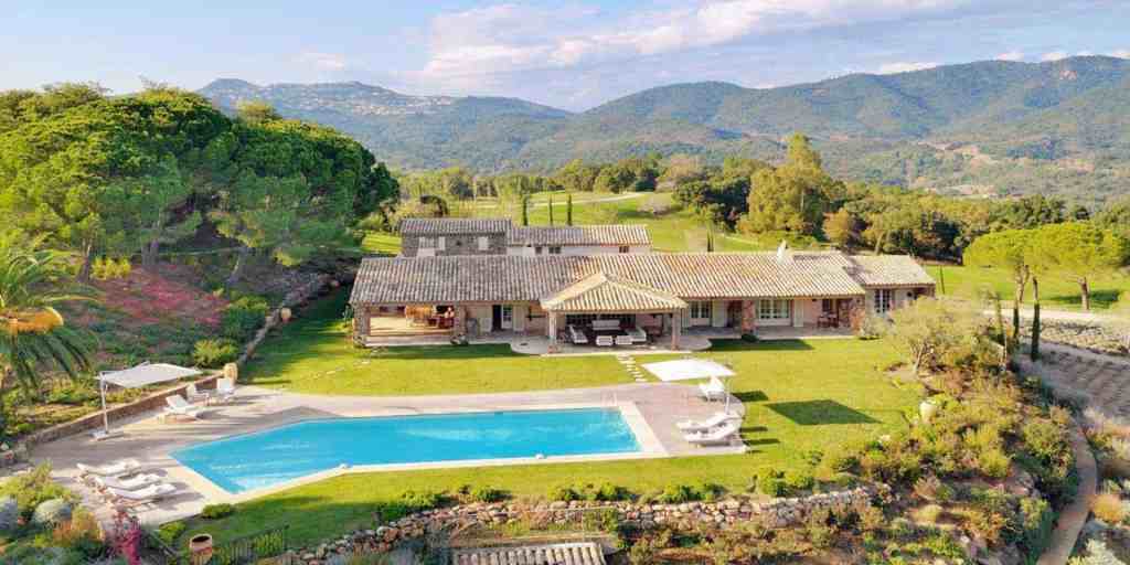 Elegant villa with swimming pool and lush gardens in Cannes, France.
