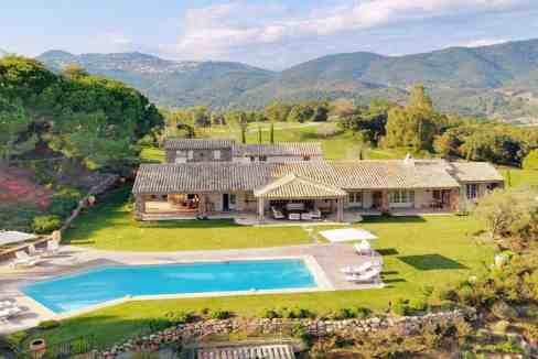 Elegant villa with swimming pool and lush gardens in Cannes, France.