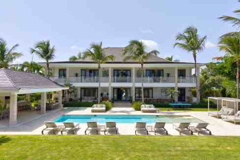 Luxury serviced apartment with pool and tropical garden setting.