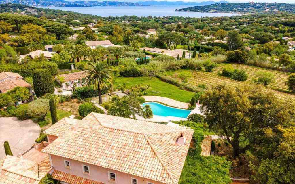 Aerial view of a Provençal villa with swimming pool and lush gardens in Saint-Tropez.