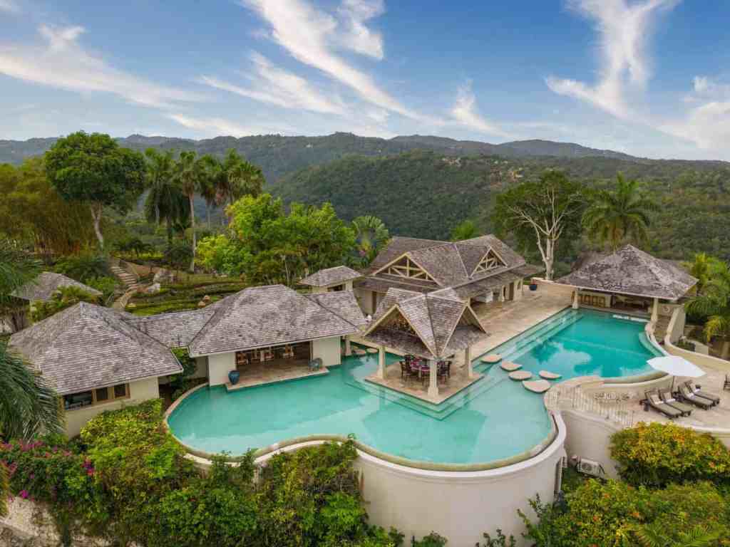 Luxury villa with pool and lush tropical landscape in Montego Bay.